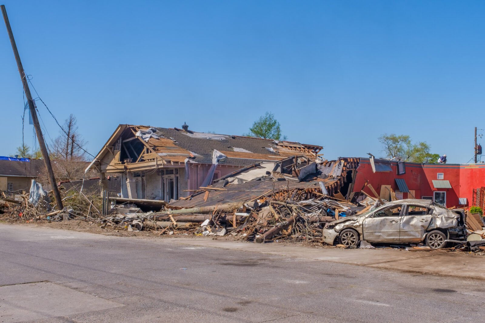 Severely Damaged Buildings and Car after Tornado Touched Down on March 22, 2022 in Arabi, LA, USA